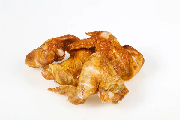 Smoked chicken wings over white background