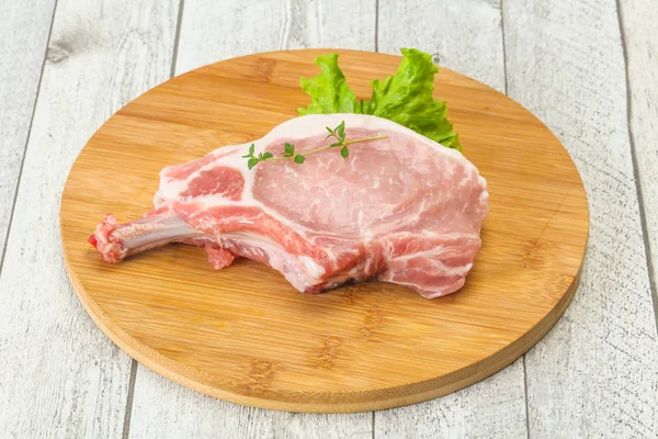 Raw pork bone steak over wooden — Stock Photo, Image