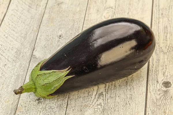Black ripe fresh eggplant over background — 스톡 사진