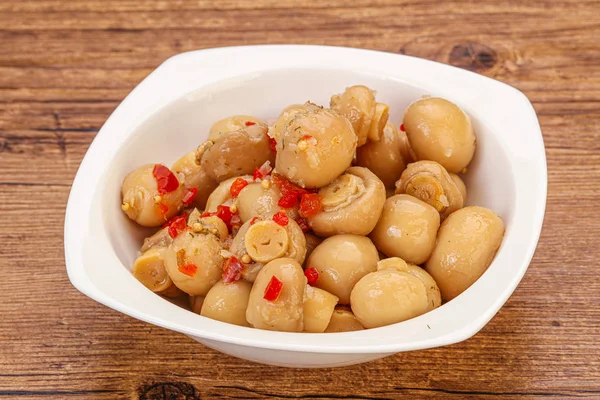 Pickled champignons in the bowl — Stockfoto