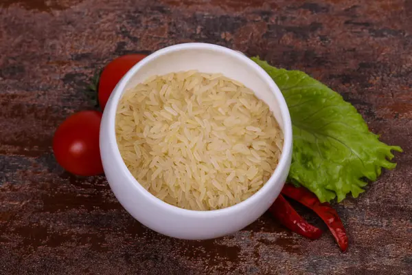 Raw Uncooked Rice Bowl Served Pepper Salad Leaves — Stock Photo, Image