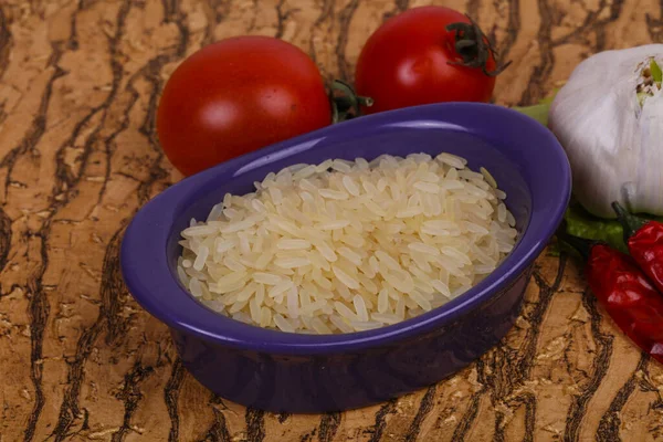 Raw Uncooked Rice Bowl Served Pepper Salad Leaves — Stock Photo, Image