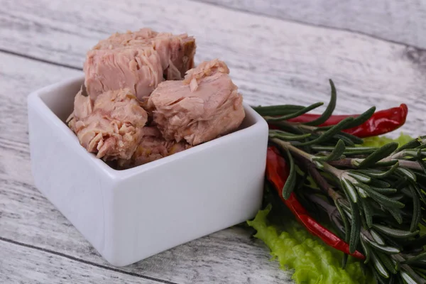 Tasty canned tuna fish in the bowl served salad leaves