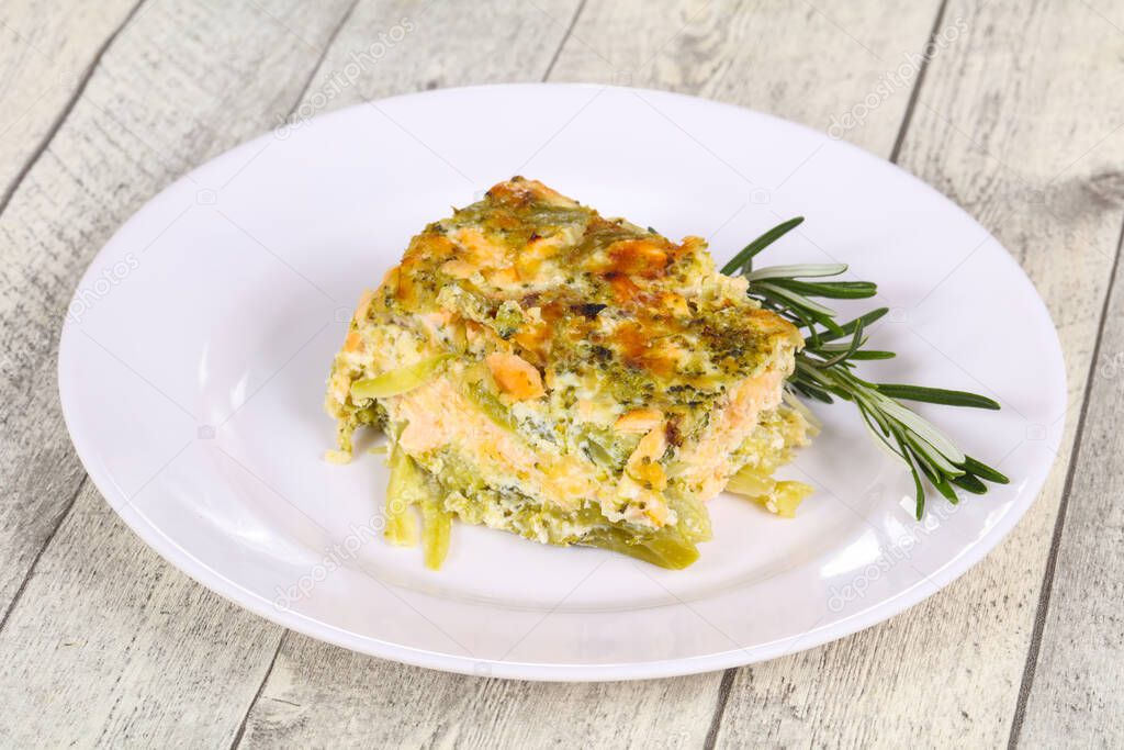 Tasty casserole with salmon and broccoli served rosemary