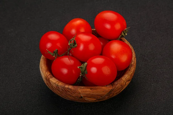 Ripe juicy red cherry tomato in the bowl