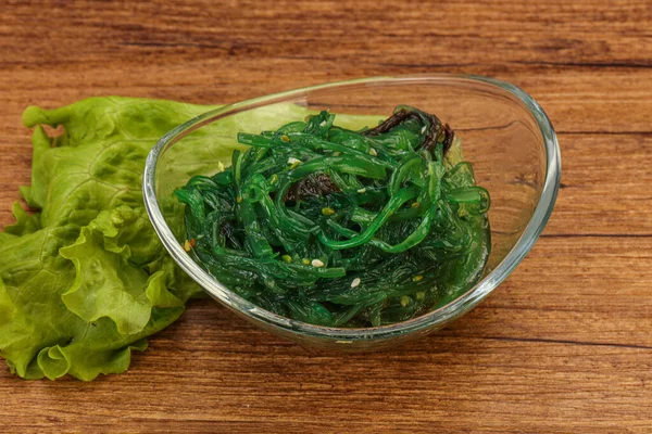 Green Chuka Seaweed Salad Isolated on White Background Top View. Wakame Sea Kelp Salat, Chukka Sea Weed, Healthy Algae Food