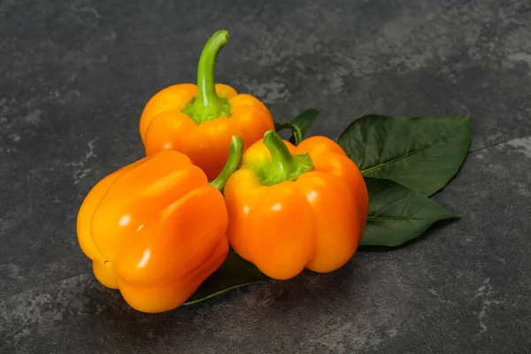 Ripe Yellow Bell pepper with leaves