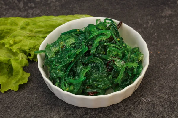 Green Chuka Seaweed Salad Isolated on White Background Top View. Wakame Sea Kelp Salat, Chukka Sea Weed, Healthy Algae Food