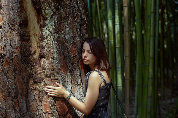 Young adorable woman closeup portrait near tree — Stock Photo, Image