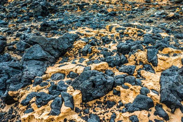 Stones from hardened volcanic lava — Stock Photo, Image