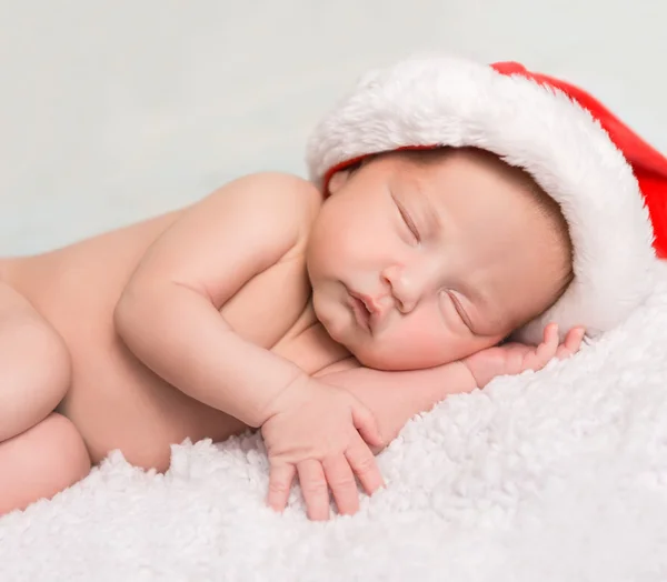 Sweet newborn baby in red hat — Stock Photo, Image