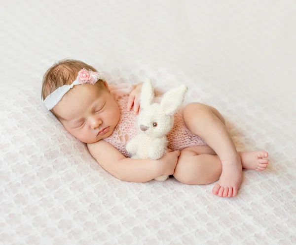 Sleeping newborn girl with headband Royalty Free Stock Photos