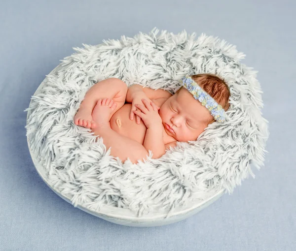 Funny newborn girl with headband — Stock Image Funny newborn girl with headband Stock Photo