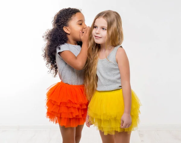 Little smiling girls gossiping — Stock Photo, Image