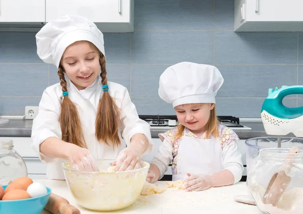 Two little girls in chef uniforms — Stock Photo, Image