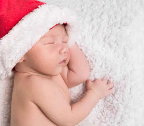 Sweet newborn baby in red hat — Stock Photo, Image