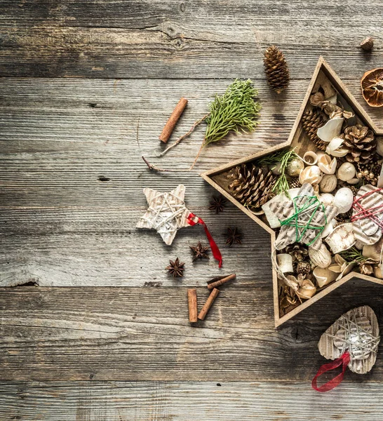 Christmas decorations in star shaped box — Stock Photo, Image