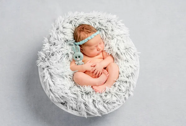Funny newborn girl with headband — Stock Photo, Image