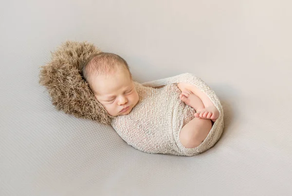 Sweet sleeping wrapped newborn baby — Stock Photo, Image