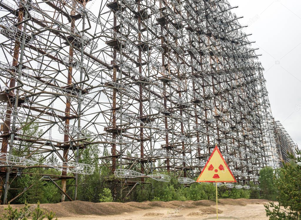 view of the Soviet radar DUGA 3 with warning sign