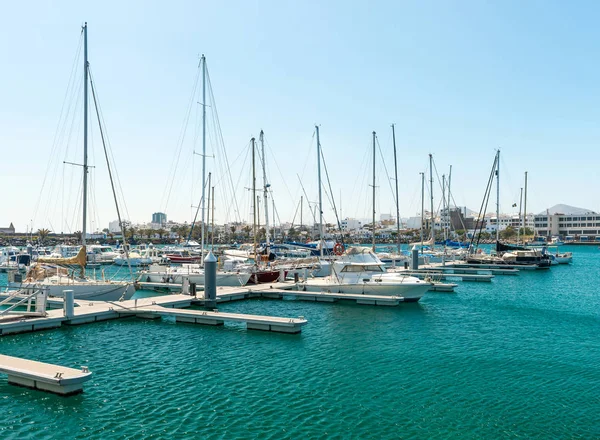 Empty slots in harbor, some boats, Spain — Stock Photo, Image