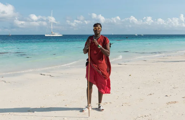 Smiling masai with sunglasses on a beach — Stock Photo, Image