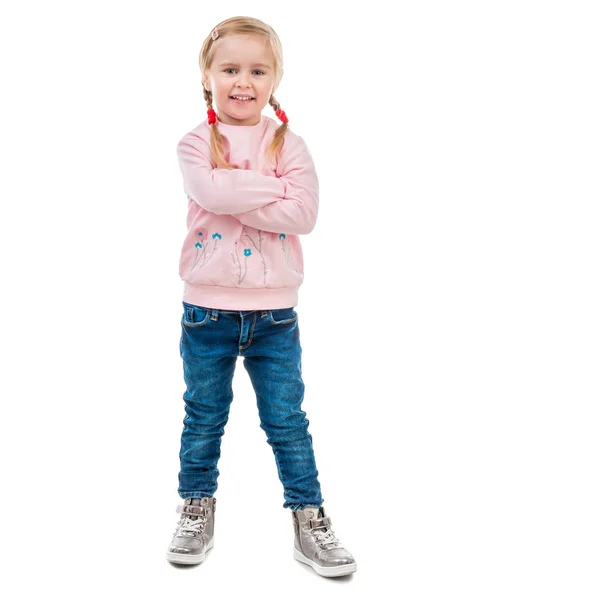 Cute little girl with her hands in pockets — Stock Photo, Image