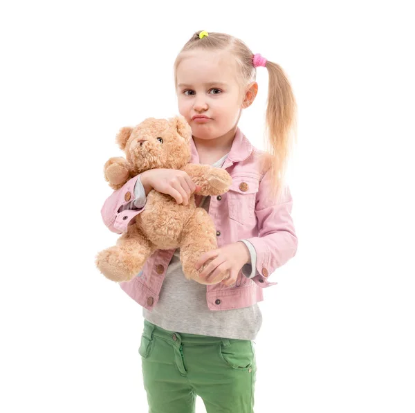 Menina com brinquedo, isolado no fundo branco — Fotografia de Stock