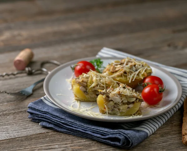 Baked cut potato full of mushrooms and cheese — Stock Photo, Image