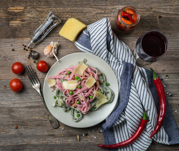 pasta in alfredo sauce, red wine, topview