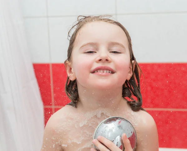 Small child enjoying a shower — Stock Photo, Image