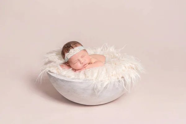 baby girl napping on huge pillow