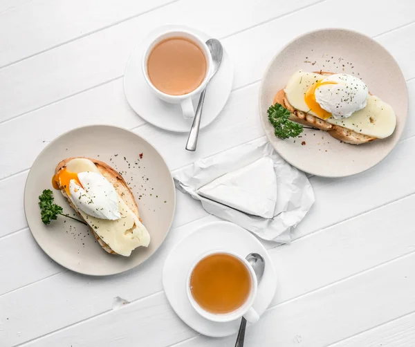 Table for two, poached egg and tea, topshot