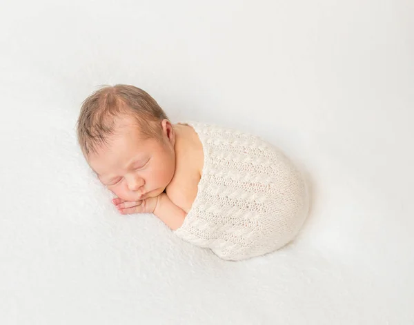 Adorable child napping covered with scarf — Stock Photo, Image