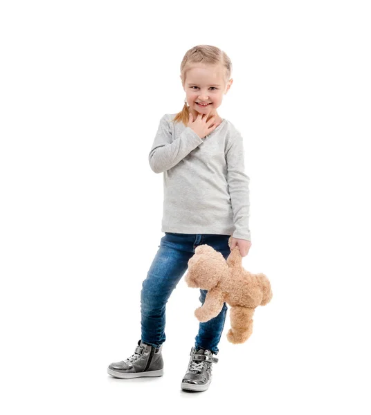 Mädchen posiert mit ihrem Teddy, isoliert — Stockfoto