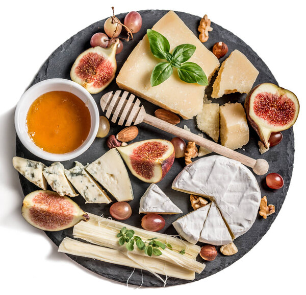 Cheese plate served with nuts and honey