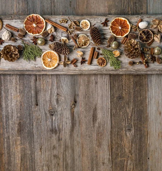 Christmas decorations with cinnamon and dried orange slices — Stock Photo, Image