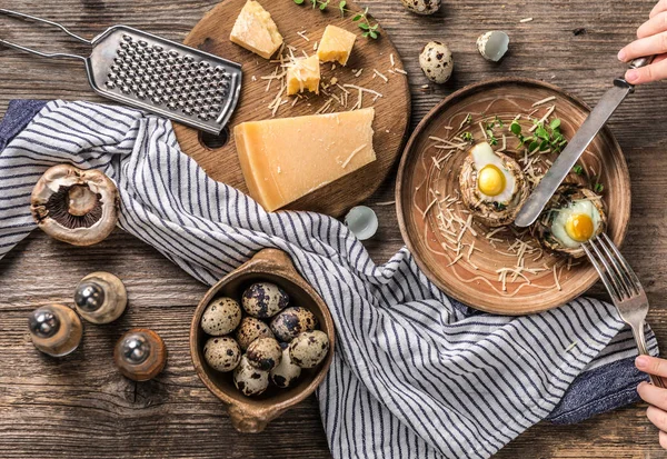 Stuffed mushrooms with quail eggs and parmesan cheese, top view. — Stock Photo, Image