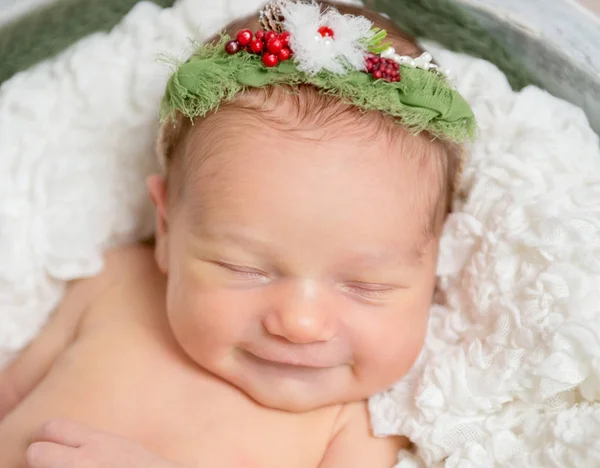 Sweet baby girl smiles while sleeping — Stock Photo, Image