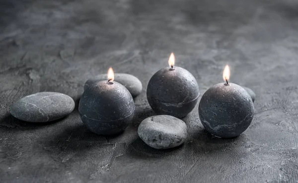 Composition of candles and massage stones — Stock Photo, Image