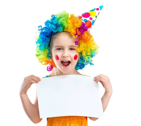 Girl in clown wig holds blank paper, isolated on white background — Stock Photo, Image