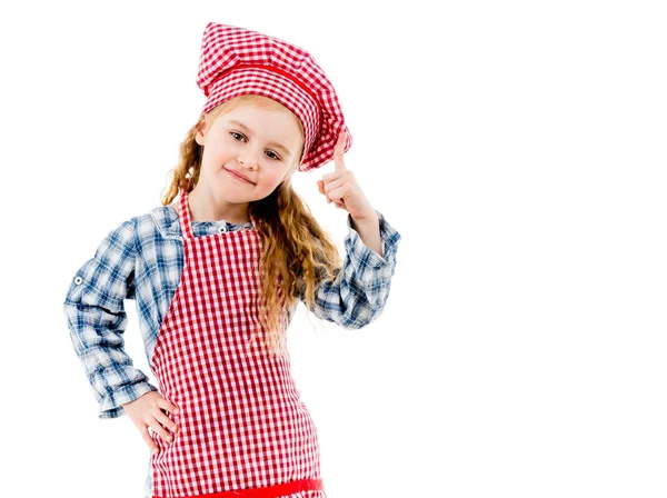 Pouco bonito chef menina apontando para cima isolado no fundo branco — Fotografia de Stock