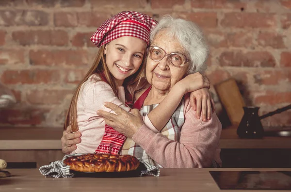 Granddaughter hug her happy grandmother — Stock Photo, Image