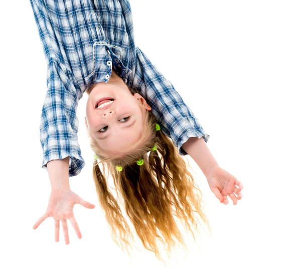 Little fgirl hanging upside down — Stock Photo, Image