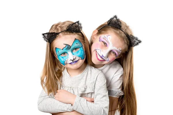 Dos niñas con caras pintadas — Foto de Stock