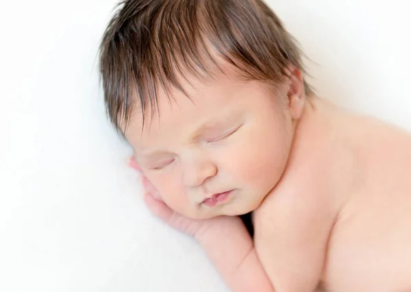 Sweet newborn baby sleeping on white blanket — Stock Photo, Image