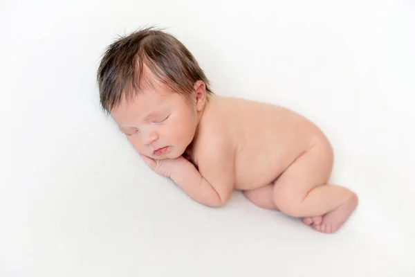 Dreamy newborn baby sleeping on bed — Stock Photo, Image