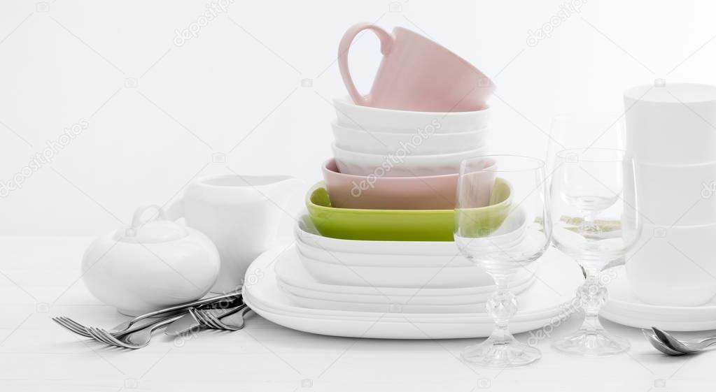 Pile of colourful square dishes and cups