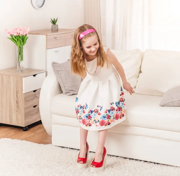 Child trying new heel shoes — Stock Photo, Image