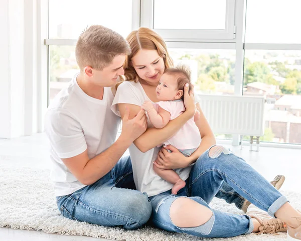 Parents holding up baby — Stock Photo, Image